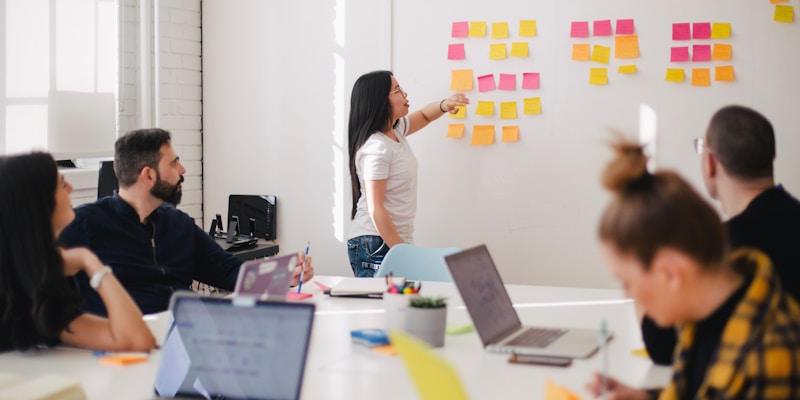 Team analyzing customer data and audience insights on multiple screens
